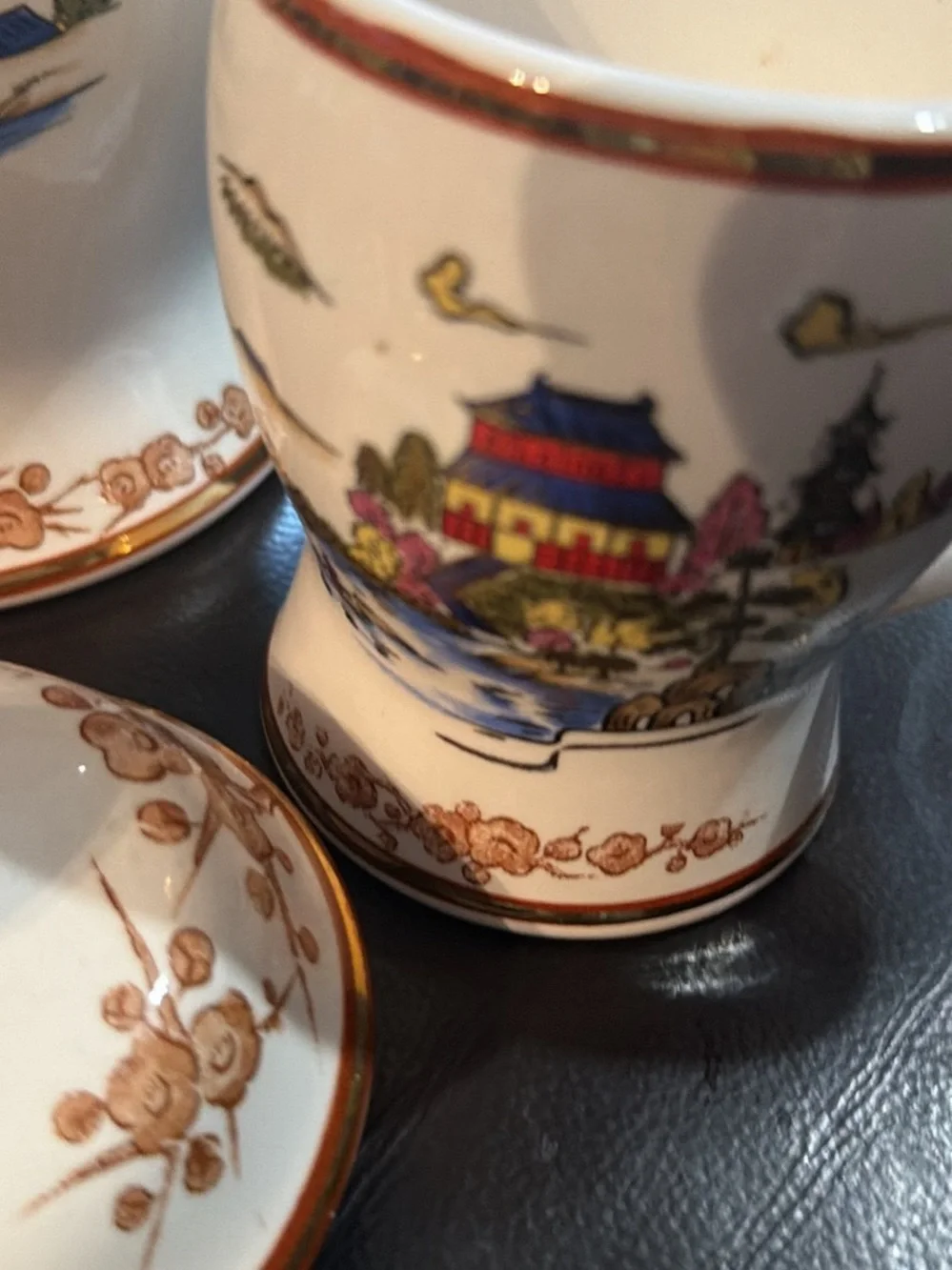 White Ceramic Tea Set with Gold Trim and Oriental Scenic Design
